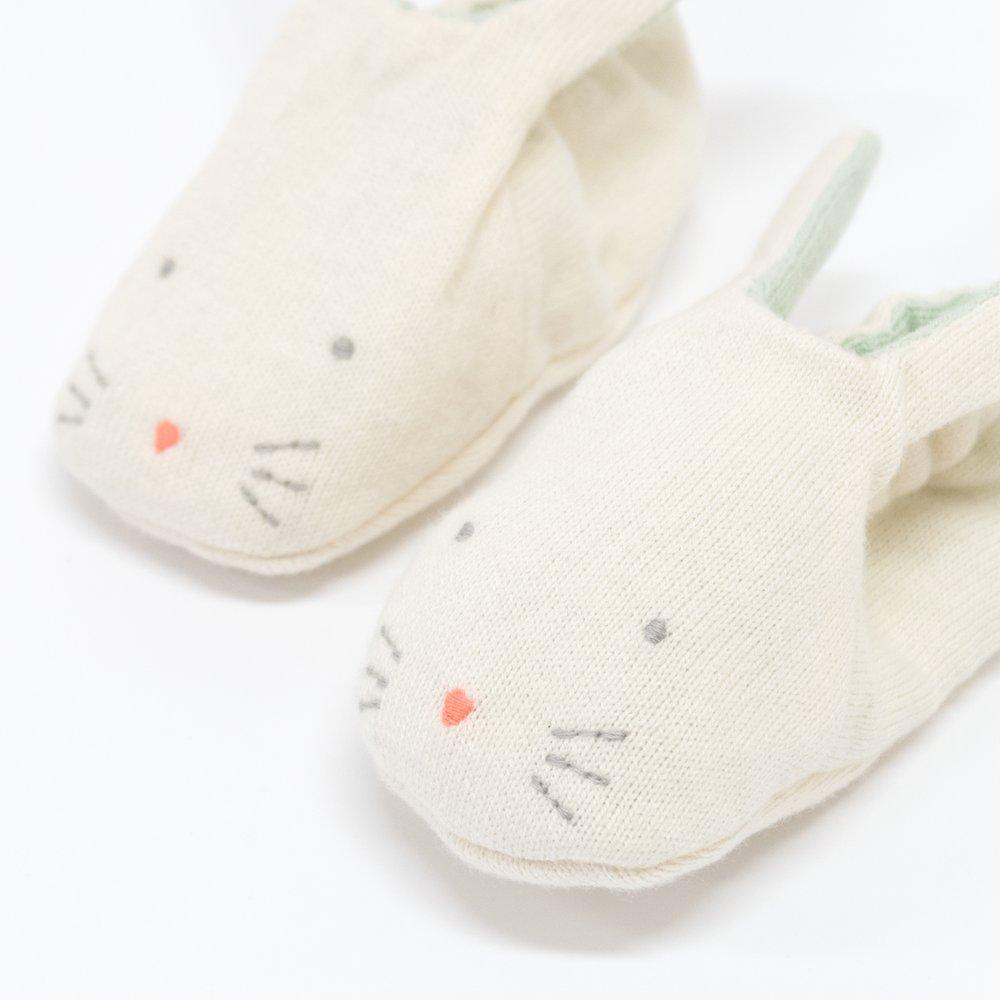 These adorable bunny booties are crafted from knitted organic cotton, with a mint lining, stitched features and floppy ears.