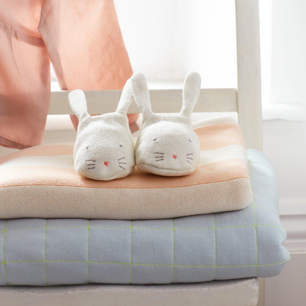 These adorable bunny booties are crafted from knitted organic cotton, with a mint lining, stitched features and floppy ears.