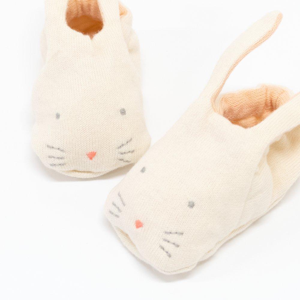 These adorable bunny booties are crafted from knitted organic cotton, with a peach lining, stitched features and floppy ears.