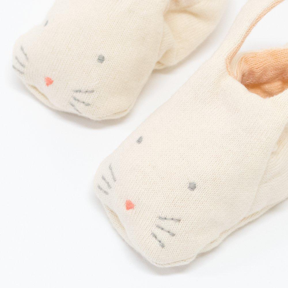 These adorable bunny booties are crafted from knitted organic cotton, with a peach lining, stitched features and floppy ears.