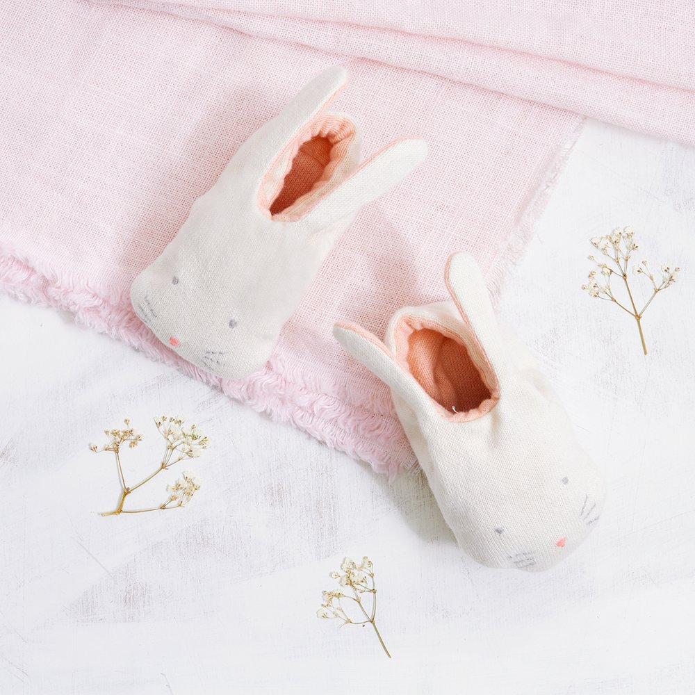 These adorable bunny booties are crafted from knitted organic cotton, with a peach lining, stitched features and floppy ears.