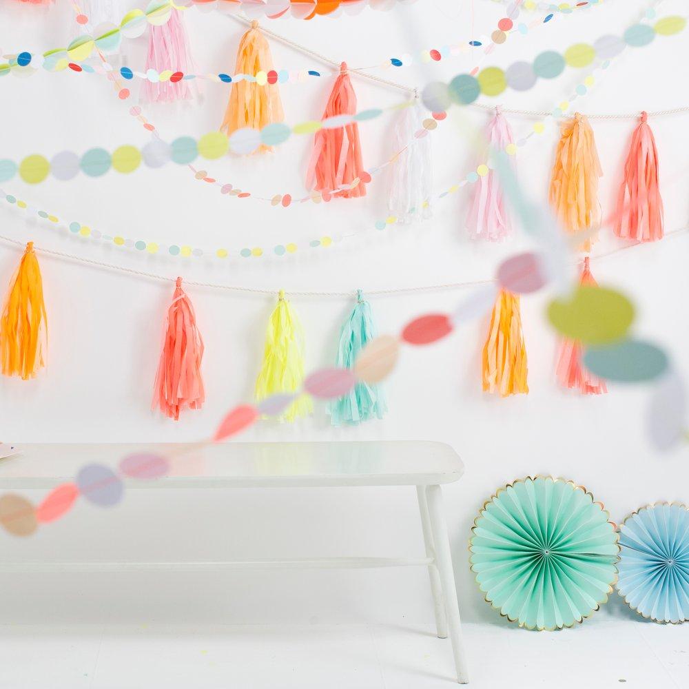 This rainbow room decoration is crafted from confetti pennants in 8 colours.