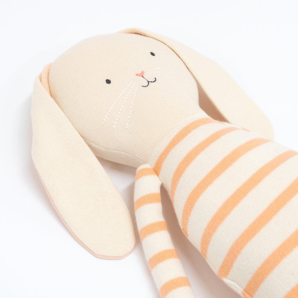 Alfalfa bunny is crafoted from knitted organic cotton, with floppy ears, a pompom tail and sweet stitched features. 