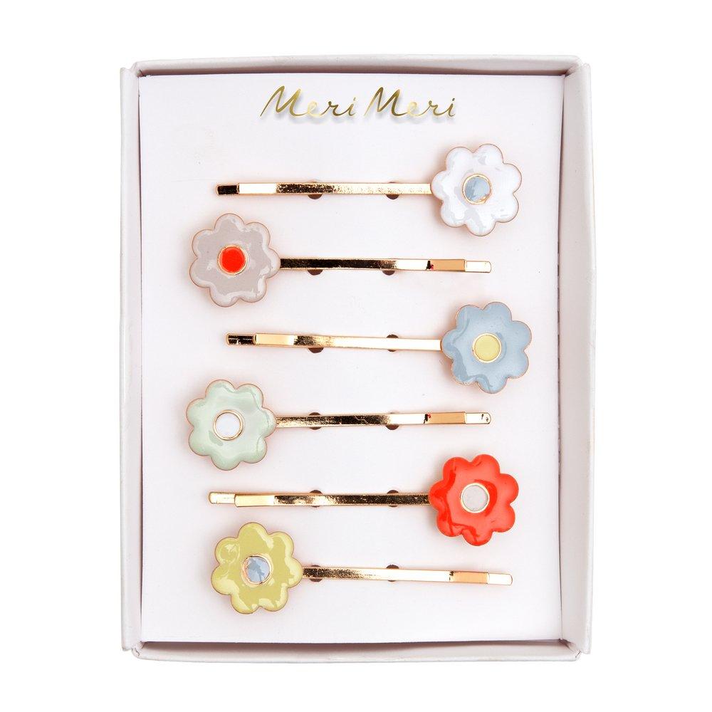 They are crafted from enamel daisies, in 6 different colours, with gold tone hair slides.