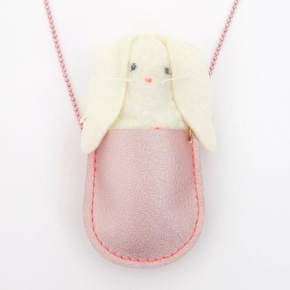 This pretty necklace features a padded felt bunny, sitting in a glittery pink leatherette pocket, with a pink bead chain. 