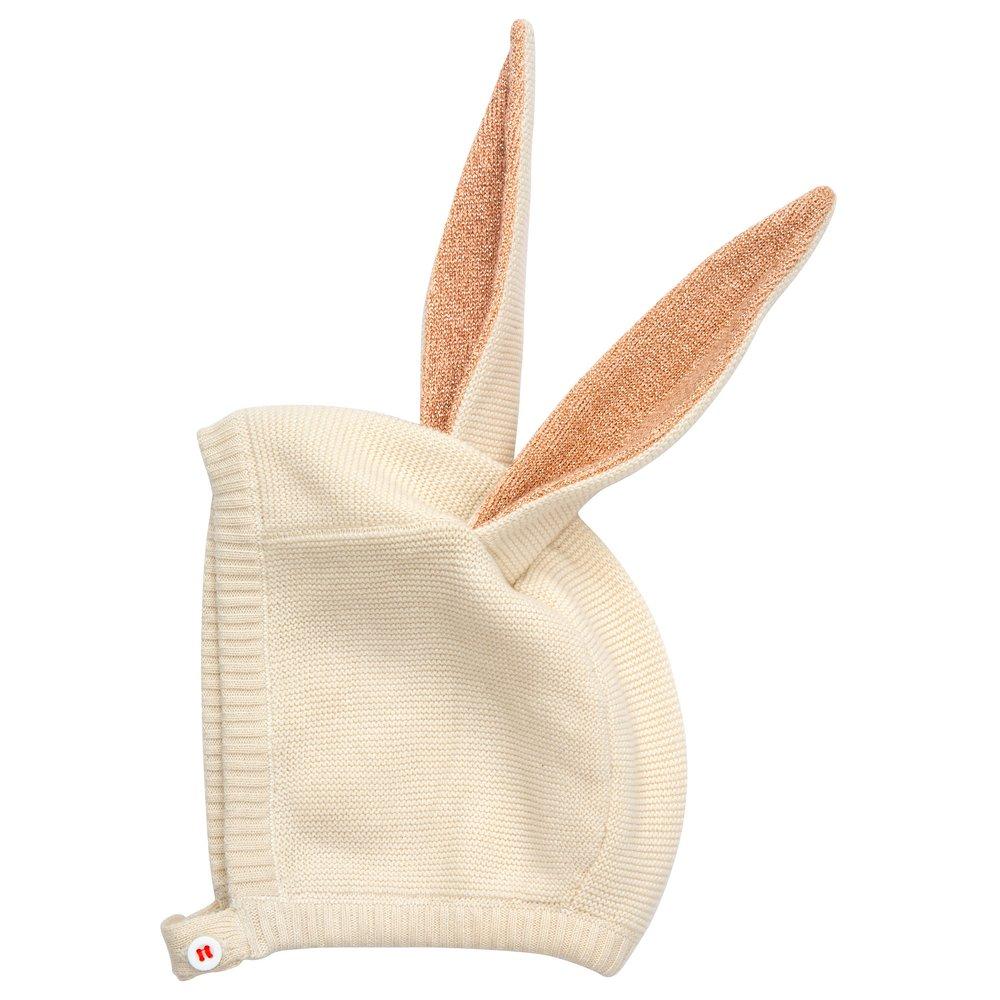 This organic cotton bunny bonnet has a shimmering peach inner on the ears, and an ivory coloured button fastening. 