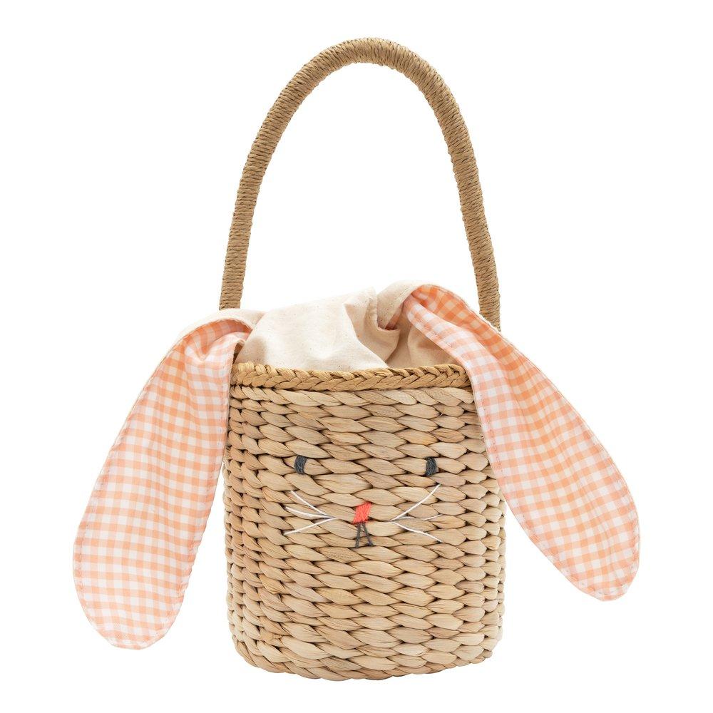 This basket is crafted from woven straw, with floppy ears, a sweet bunny face and a dellightful pompom tail. 