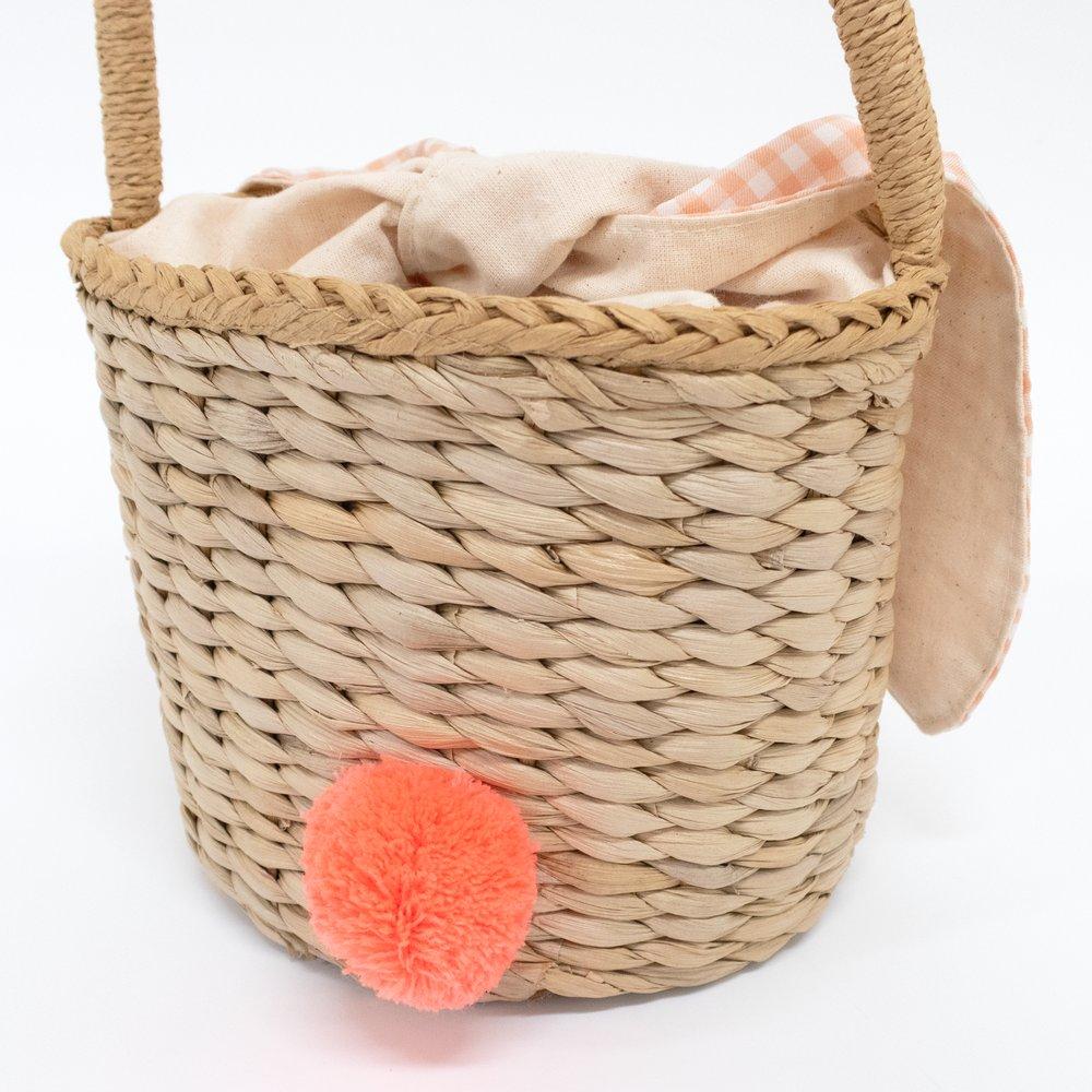 This basket is crafted from woven straw, with floppy ears, a sweet bunny face and a dellightful pompom tail. 