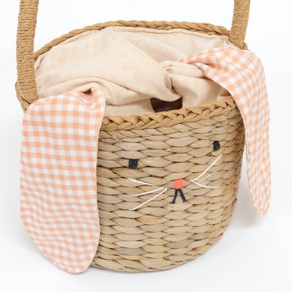 This basket is crafted from woven straw, with floppy ears, a sweet bunny face and a dellightful pompom tail. 