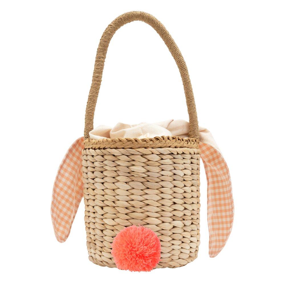 This basket is crafted from woven straw, with floppy ears, a sweet bunny face and a dellightful pompom tail. 