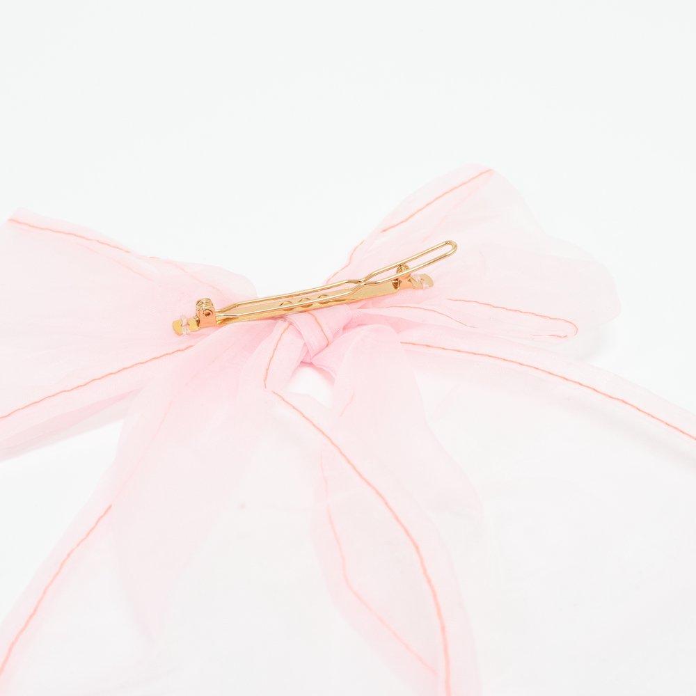 This pretty clip features a  pink net fabric bow which has beautiful butterflies embroidered on it. 