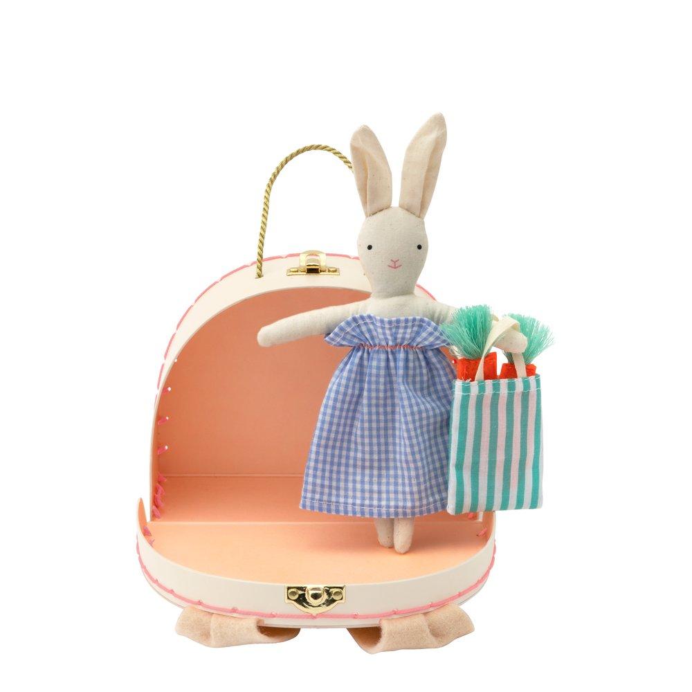 The bunny case opens to reveal an adorable mini bunny doll, with a striped tote bag and felt carrots. 