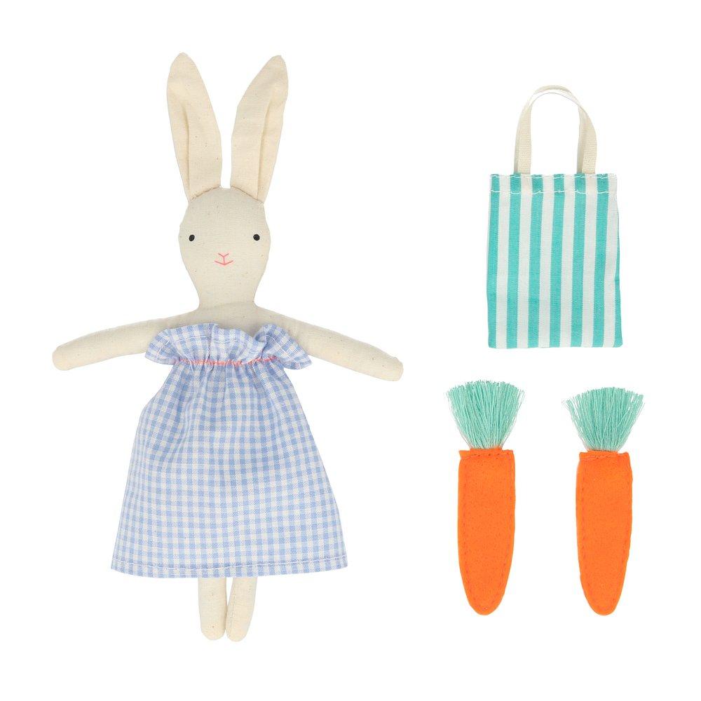 The bunny case opens to reveal an adorable mini bunny doll, with a striped tote bag and felt carrots. 