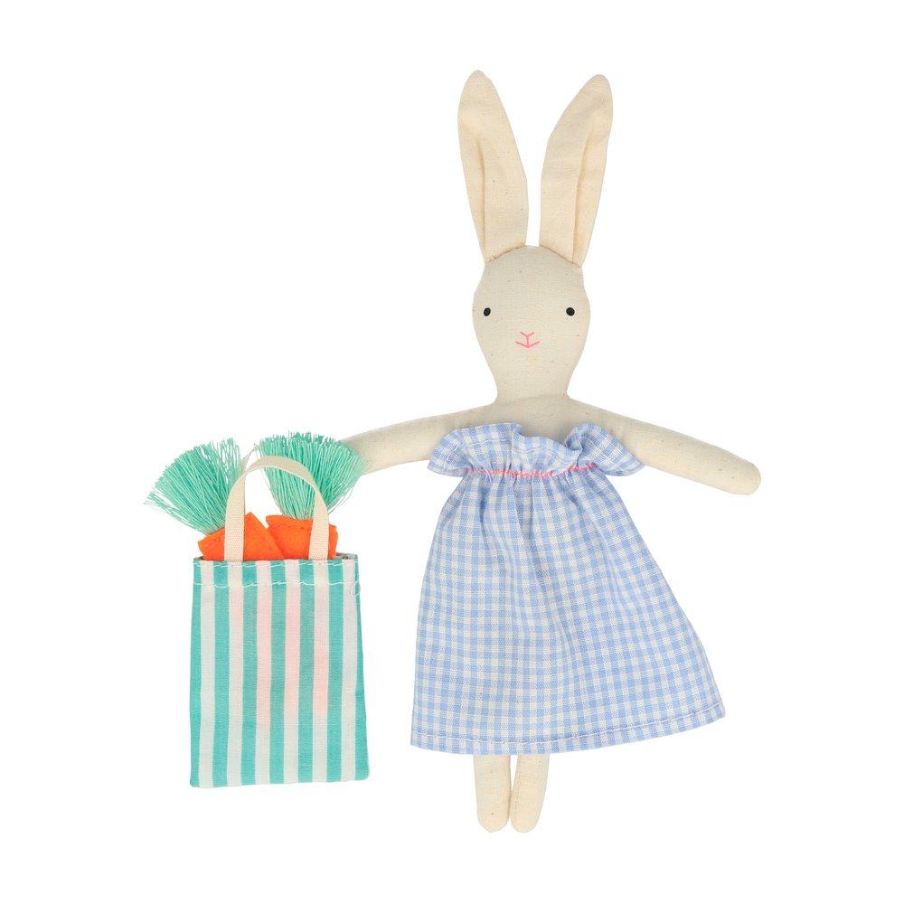 The bunny case opens to reveal an adorable mini bunny doll, with a striped tote bag and felt carrots. 