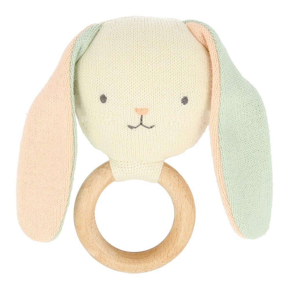 This beautiful bunny rattle is crafted from knitted organic cotton, with sweet stitched features and a wooden grip ring. 