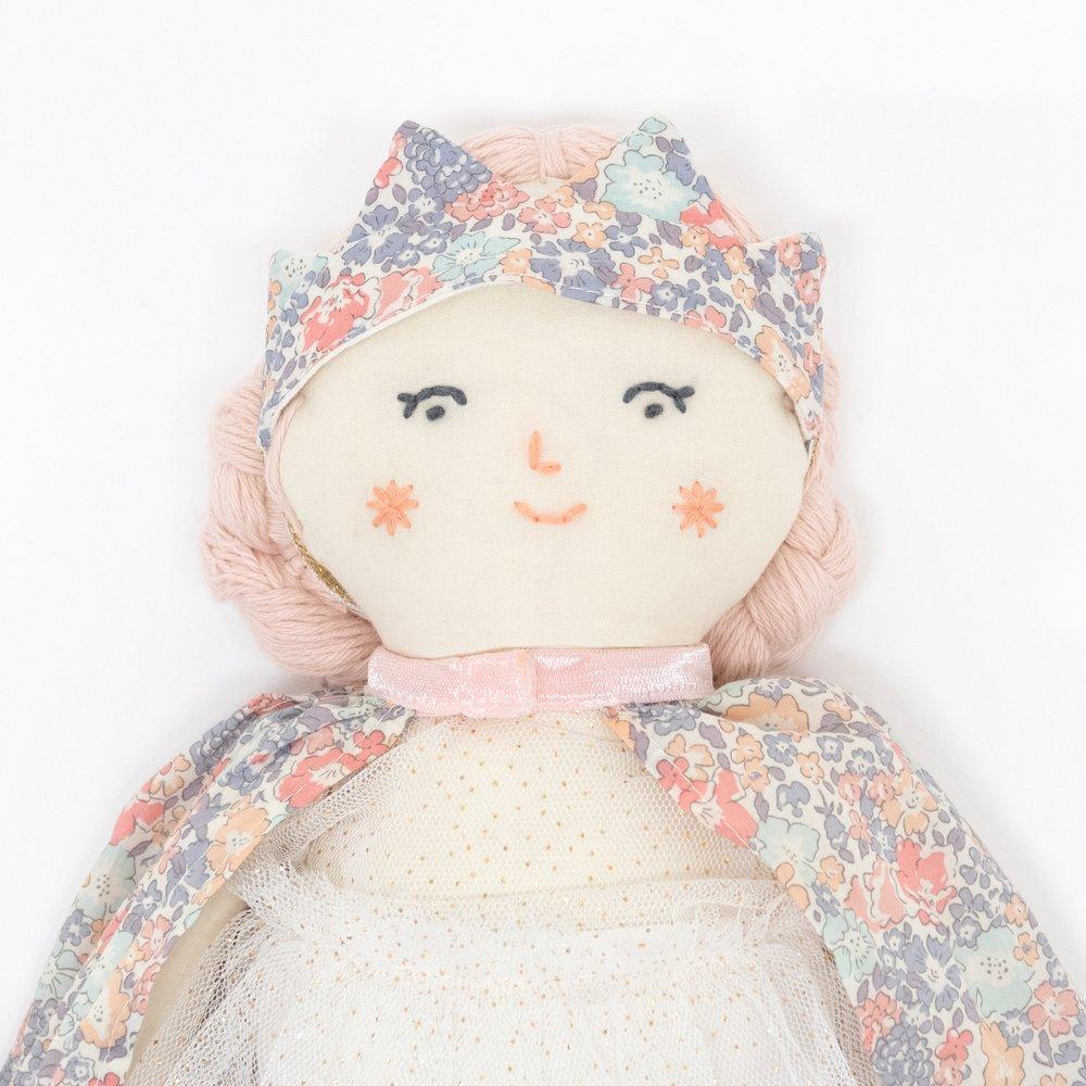 This beautiful princess doll has a white tulle dress with a Liberty floral cape, a crown and a star wand.