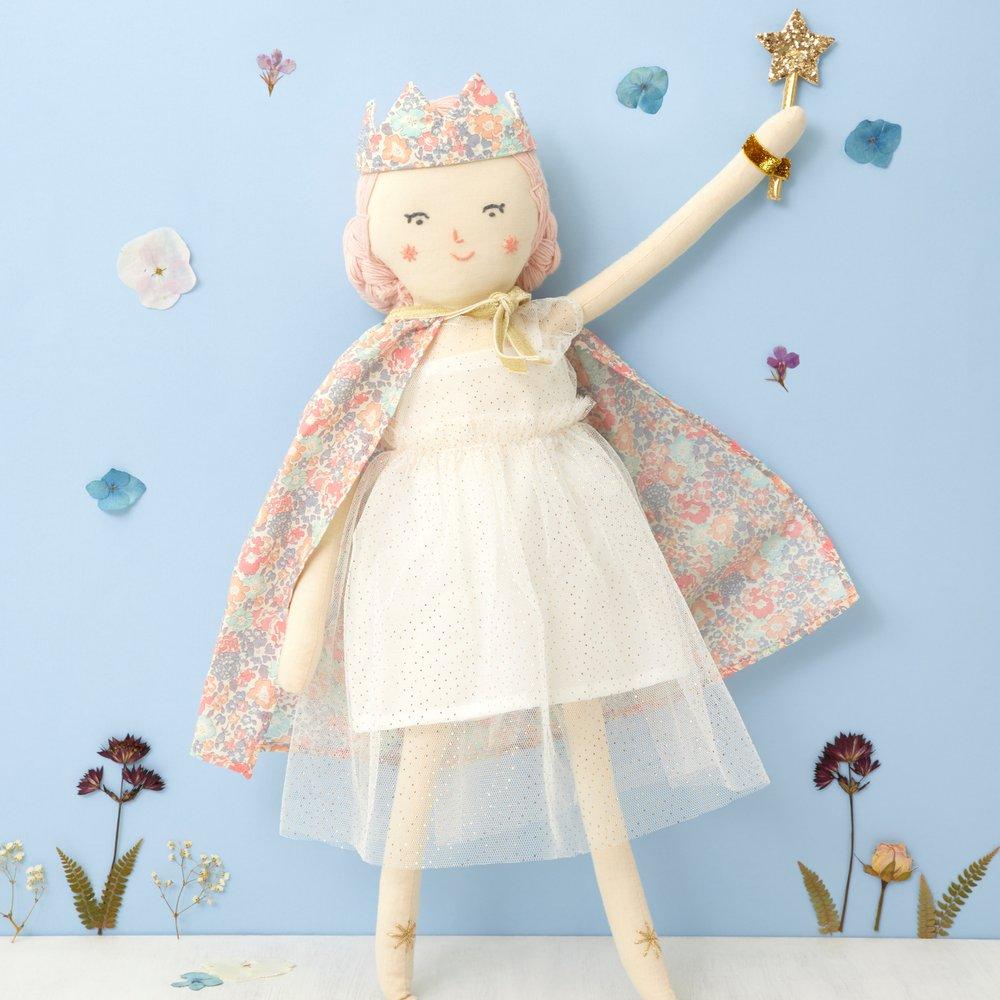 This beautiful princess doll has a white tulle dress with a Liberty floral cape, a crown and a star wand.