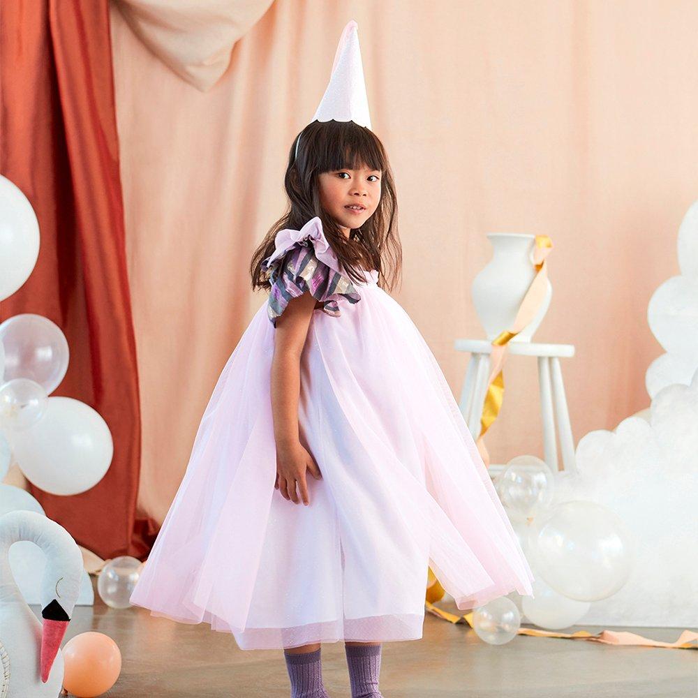 This girls costume, with a princess dress and hat with tassels, is perfect for a princess party. 