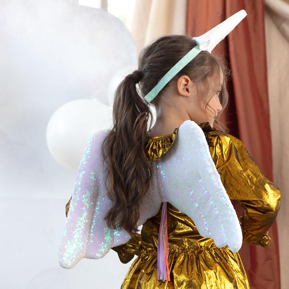 The glittery wings and unicorn headdress are crafted from pink iridescent glitter sequin fabric, with ribbon tassles.