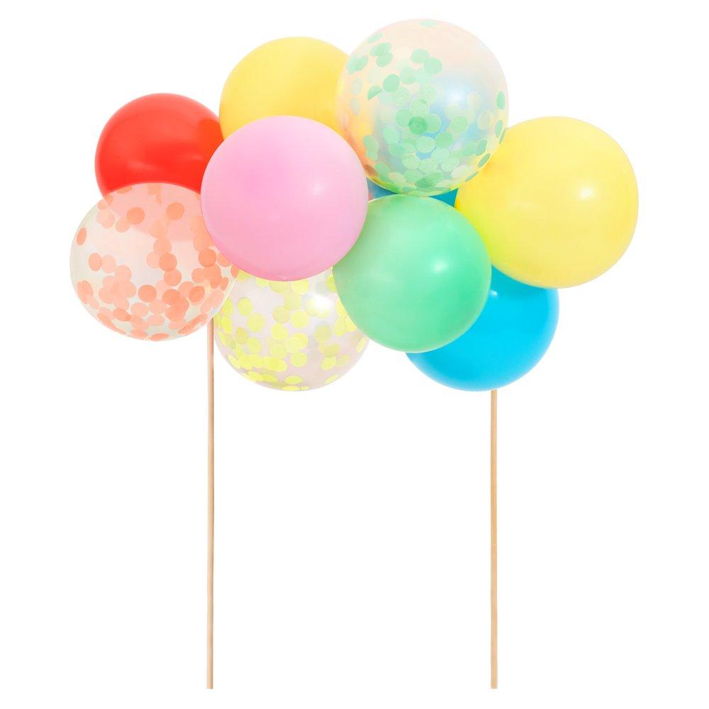 This cake topper kit includes bright balloons, confetti balloons, 2 wooden skewers, a balloon strip and an instruction sheet.