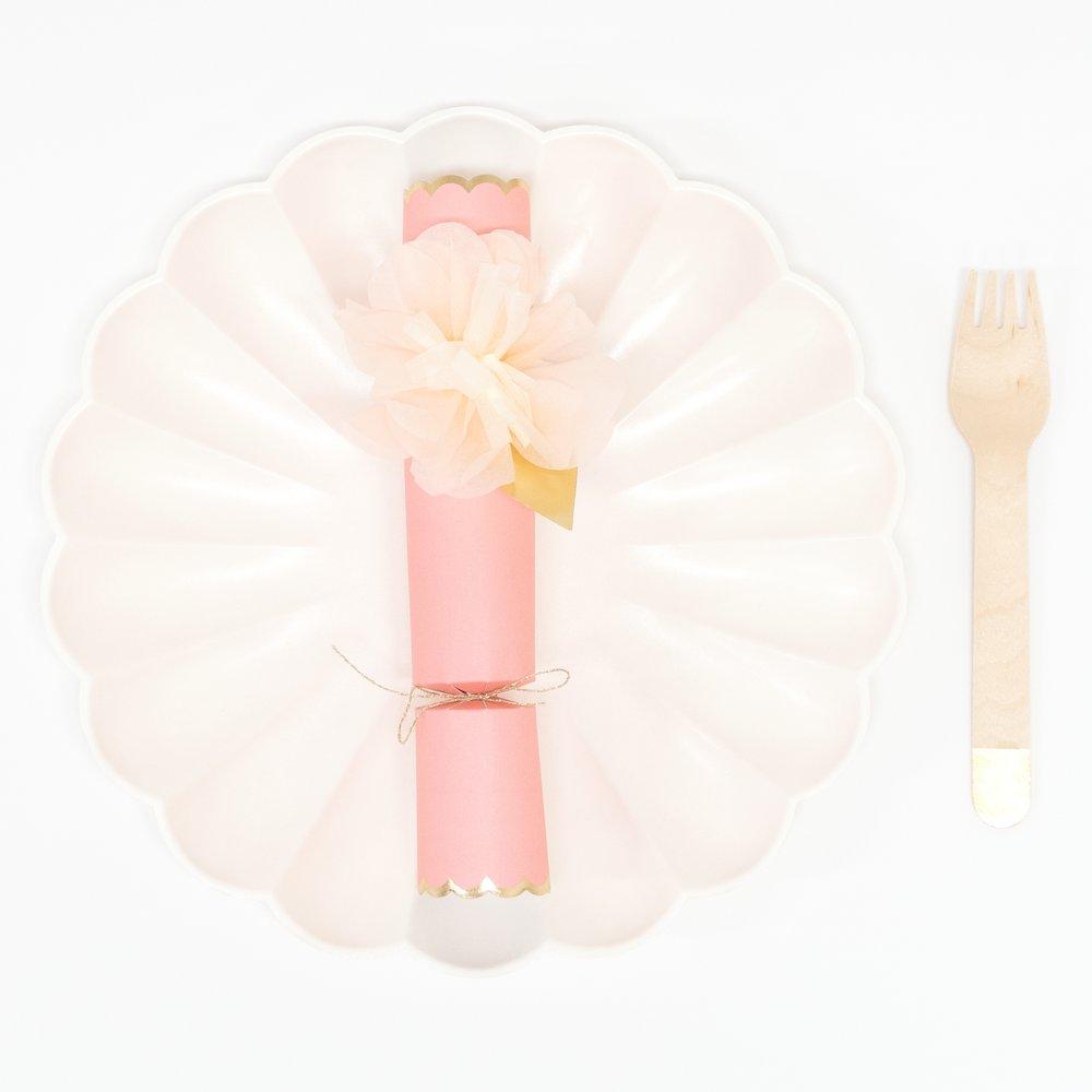 These pretty pink crackers are decorated with tissue paper flowers, and contain a tiara and sparkling glitter brooch.