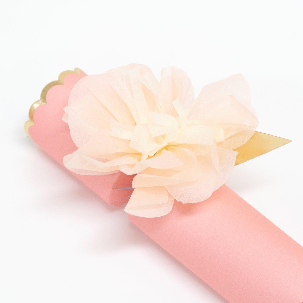 These pretty pink crackers are decorated with tissue paper flowers, and contain a tiara and sparkling glitter brooch.