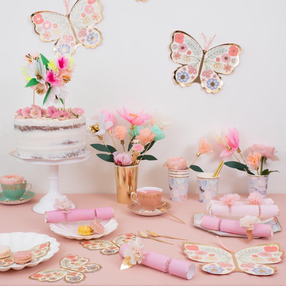 These pretty pink crackers are decorated with tissue paper flowers, and contain a tiara and sparkling glitter brooch.