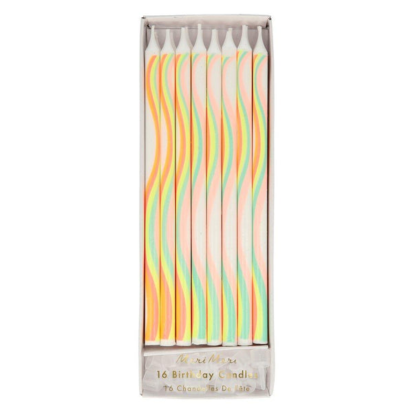 These candles, with a swirling rainbow pattern, are perfect for a rainbow party theme or a baby shower. 